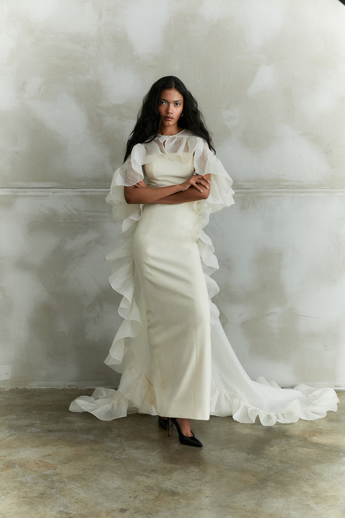 Sleeveless Gown With Organza Train And Ruffled Organza Cape