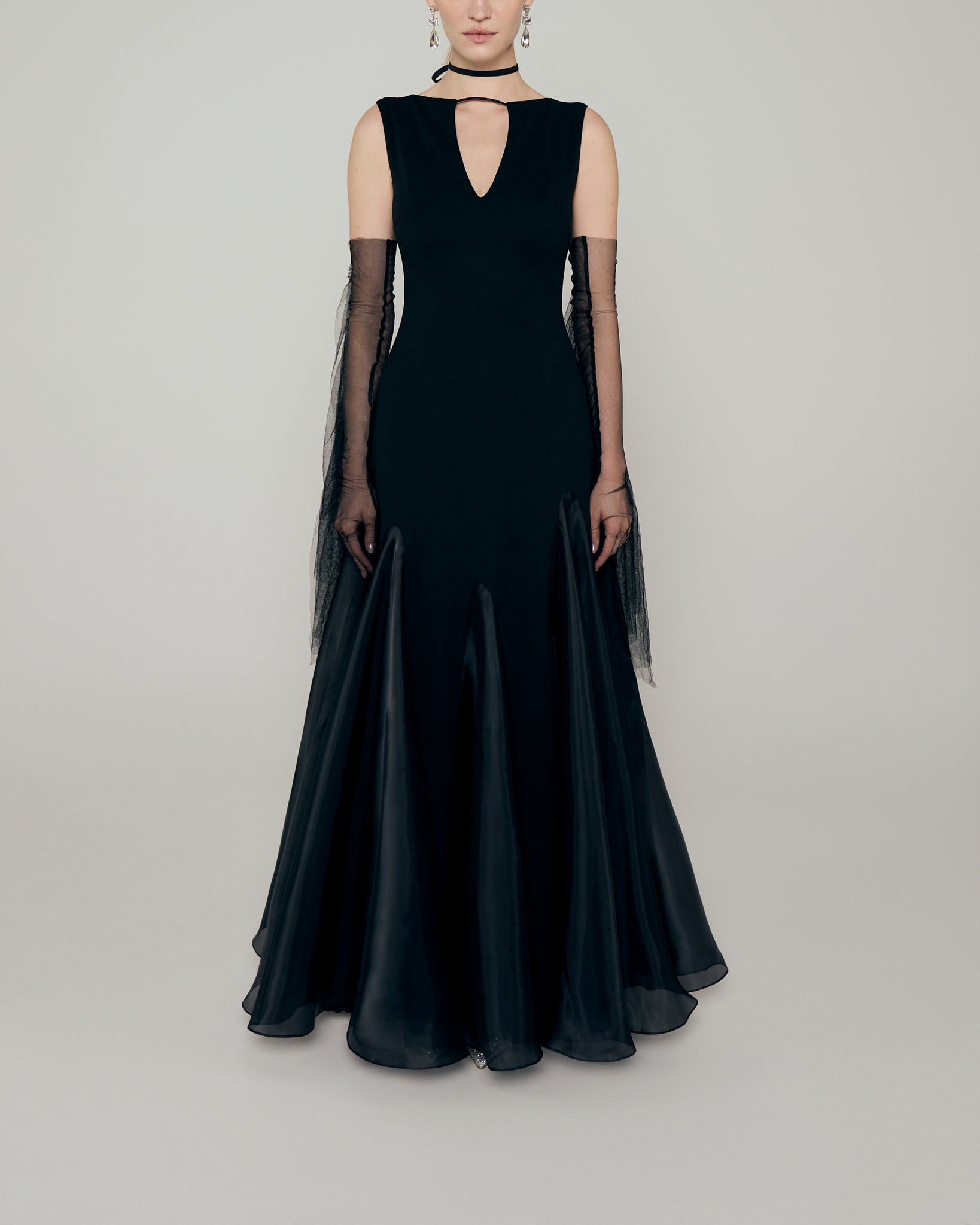 Sleeveless stretch crepe a line gown with neckline cutout, organza inserts, and tulle fringe gloves