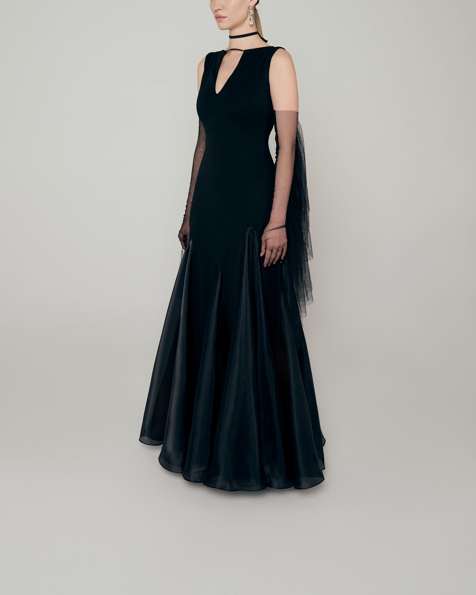 Sleeveless stretch crepe a line gown with neckline cutout, organza inserts, and tulle fringe gloves